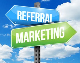 Sign post showing the words Referral and Marketing as possible paths.