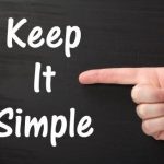 Finger pointing at text that says Keep it Simple