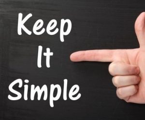 Finger pointing at text that says Keep it Simple