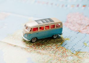 Toy van sitting on a map.