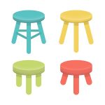 Photo of four stools, one green, one yellow, one blue, and one red