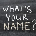 Photo of chalkboard with "What's Your Name" written on it
