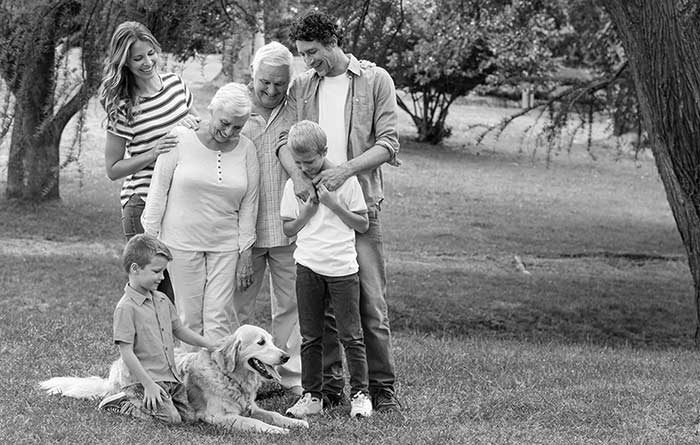 A family enjoying their dog